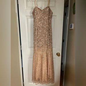 Peach/Pink Milano Formals Prom dress covered in silver sparkles and gems.